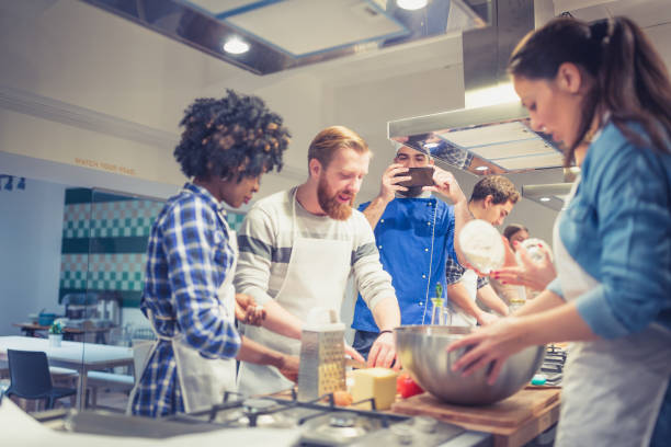 istock Chef is photographing attendees of cooking class 942153644