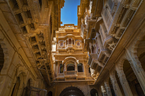 Historic Patwon ki haveli heritage building exterior with intricate artwork at Jaisalmer Rajasthan, India. Rajasthan heritage building exterior with intricate stone artwork known as the Patwon ki haveli at Jaisalmer. A popular tourist destination. jaisalmer stock pictures, royalty-free photos & images