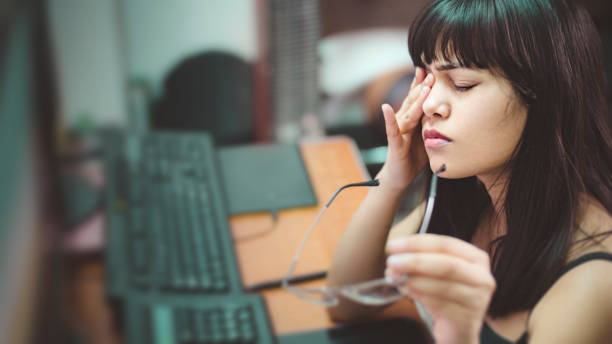 istock Young woman with aching eyes after working on computer. 942153934