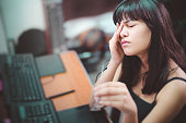 istock Young woman with aching eyes after working on computer. 942153940