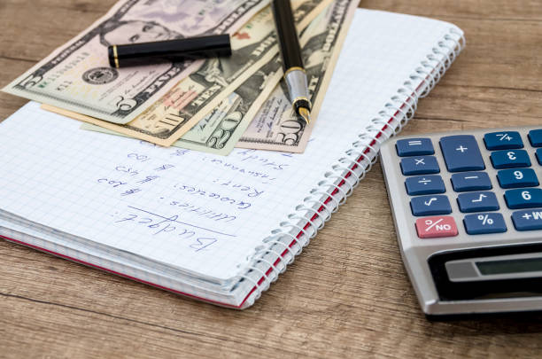 istock Home budget with money,  pen and calculator 942154820