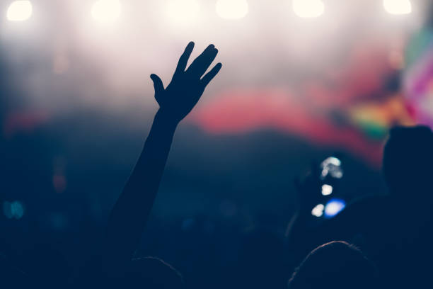 istock Cheering crowd at concert enjoying music performance 942155526