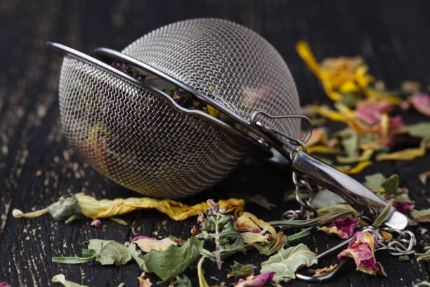 istock Heap of medicinal herbs for tea on wooden table 942156392