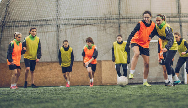 istock Women football training indoors 942156806