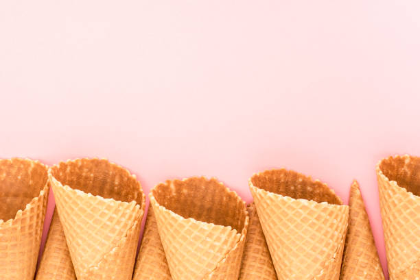 istock Ice cream cones on pink background 942157752