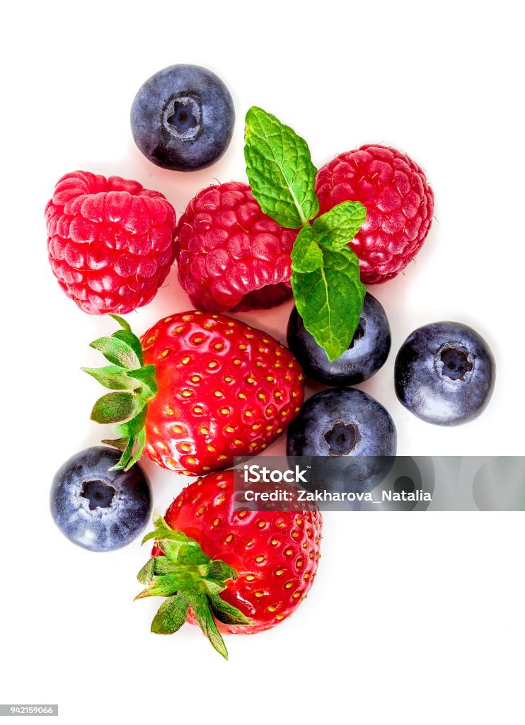 Fresh berries isolated on white background, top view. Strawberry, Raspberry, Blueberry and Mint leaf, flat lay"n Berry Fruit Stock Photo