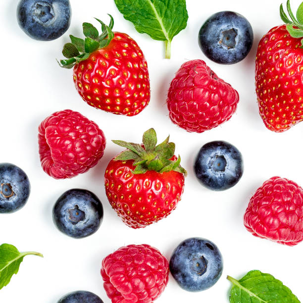 istock Berry Pattern. Fresh berries isolated on white background, top view. Strawberry, Raspberry, Blueberry and Mint leaf, flat lay