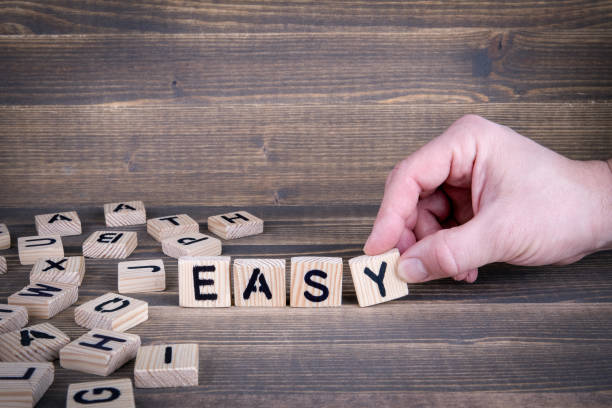 istock Easy. Wooden letters on the office desk 942159142
