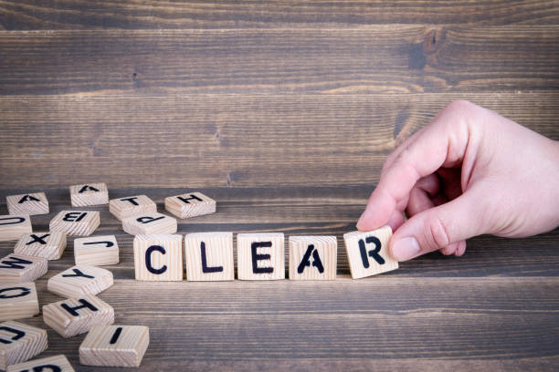 istock Clear. Wooden letters on the office desk 942159154