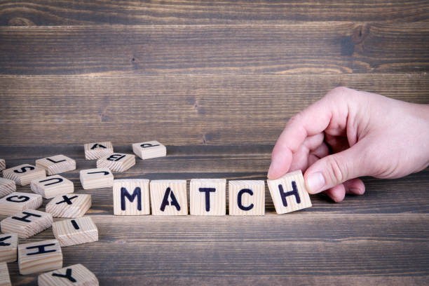 istock Match. Wooden letters on the office desk 942159156