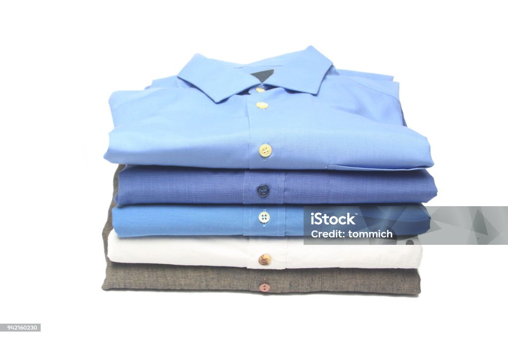 folded shirt ironed and folded shirts in the dry cleaner Folded Stock Photo