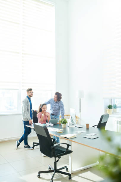 istock Optimistic business team chatting in meeting room 942160336