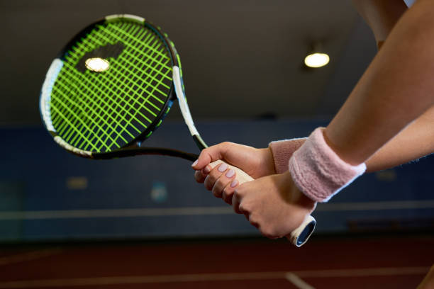 istock Woman Holding Tennis Racket 942160778