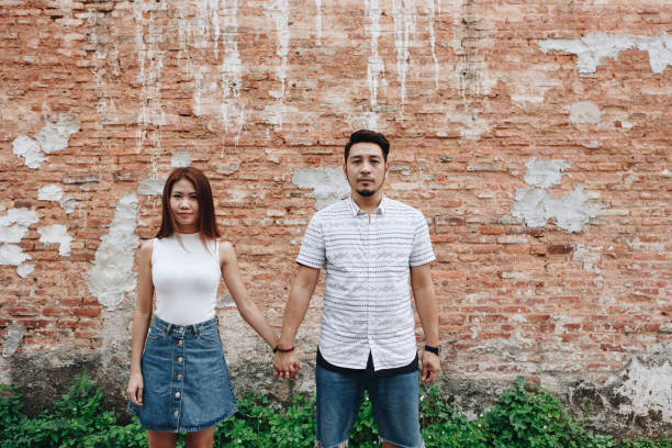 istock Asian couple holding hands together 942161756
