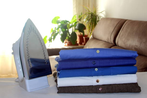 istock folded shirts in dry cleaners 942163274