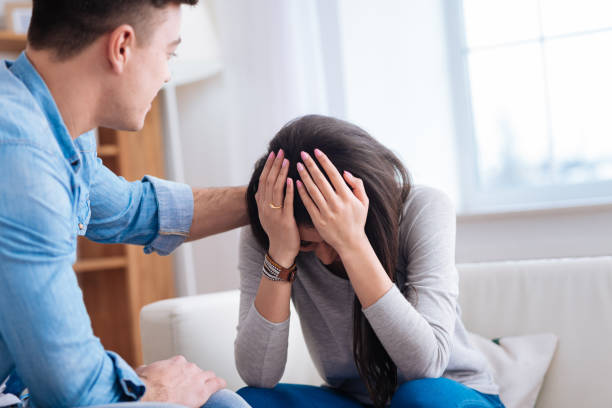 istock Man calming down upset depressed woman 942164834