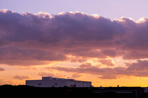 silhouette factory building at the twilight sky.