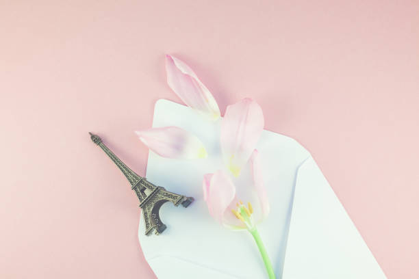 istock Pink tulip in envelope with eiffel tower miniature 942167254