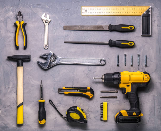 istock a set of yellow hand tool on a gray background 942167840