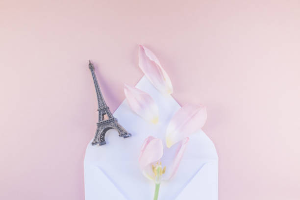 istock Pink tulip in envelope with eiffel tower miniature 942168104
