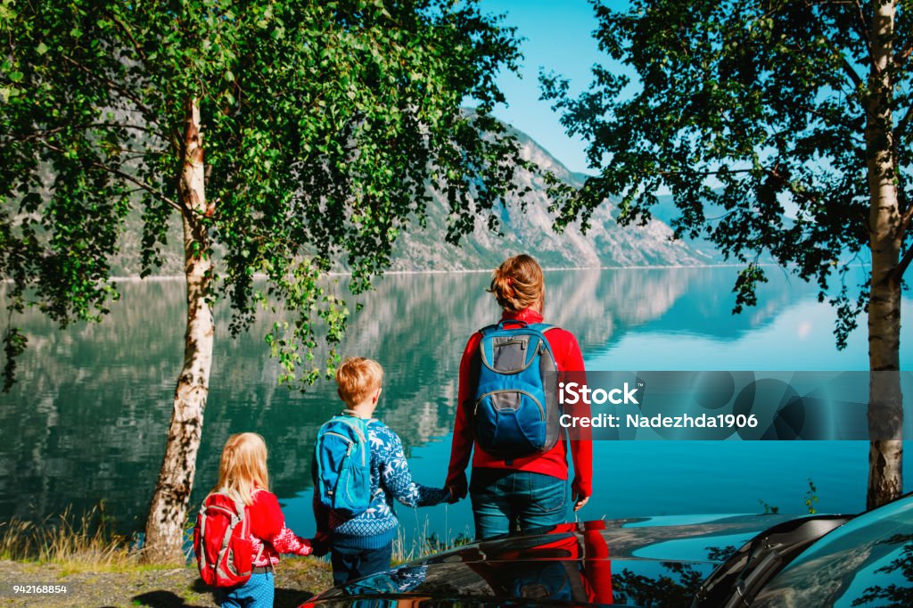 mother with son and daugther travel by car in nature mother with son and daugther travel by car in nature, Norway, Europe Family Stock Photo