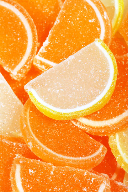 Orange and yellow Jujube jelly candies. Look like orange and lemon fruit slices. High resolution - 50 megapixels.