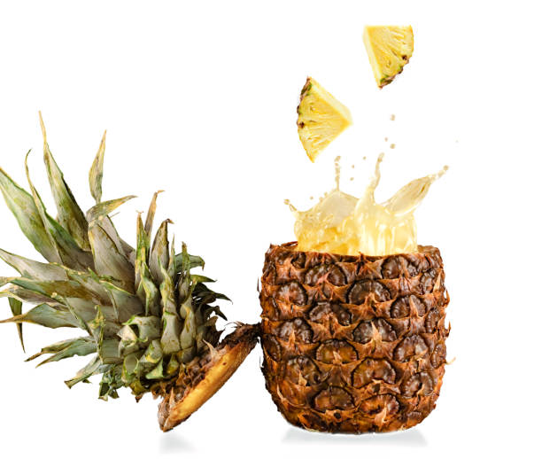 istock Real fresh and tasty pineapple splashing on white background 942169912