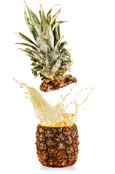 istock Real fresh and tasty pineapple splashing on white background 942169942
