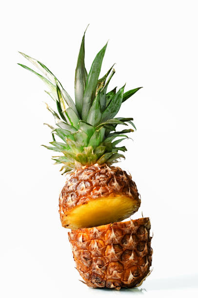 istock Fresh juicy pineaplle flying on white background 942169998