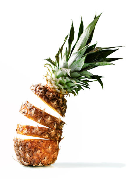 istock Fresh juicy pineaplle flying on white background 942170034