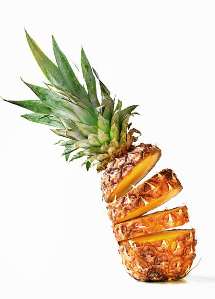 istock Fresh juicy pineaplle flying on white background 942170042