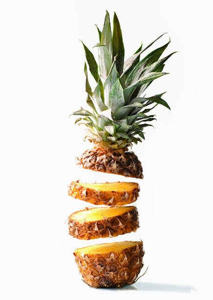 istock Fresh juicy pineaplle flying on white background 942170048