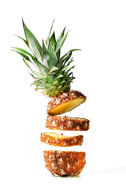 istock Fresh juicy pineaplle flying on white background 942170056