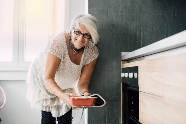 istock Senior woman preparing a dish 942172752
