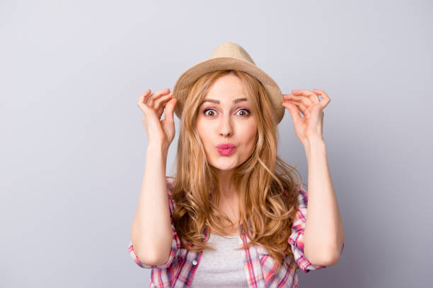istock Happy nice-looking young woman smiling with hat 942175038