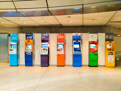a set of ATM (automatic telling machine) of famous banks in Bangkok Thailand - April 4th, 2018, competition is now equal and fair when each popular Thai bank has its own ATM at the same place