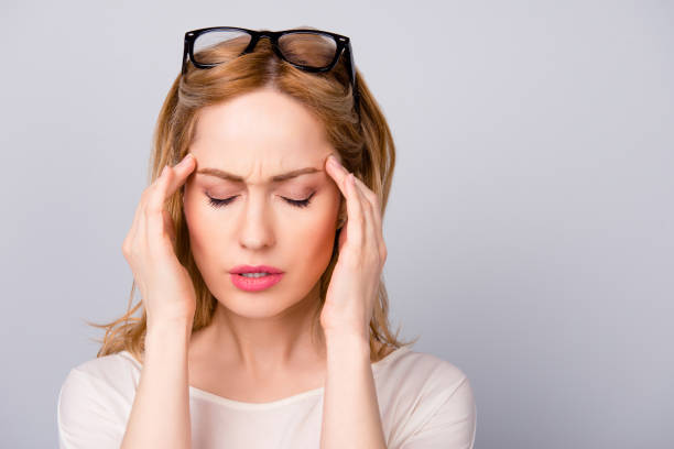 istock Business woman tired at work suffering from headache 942177232