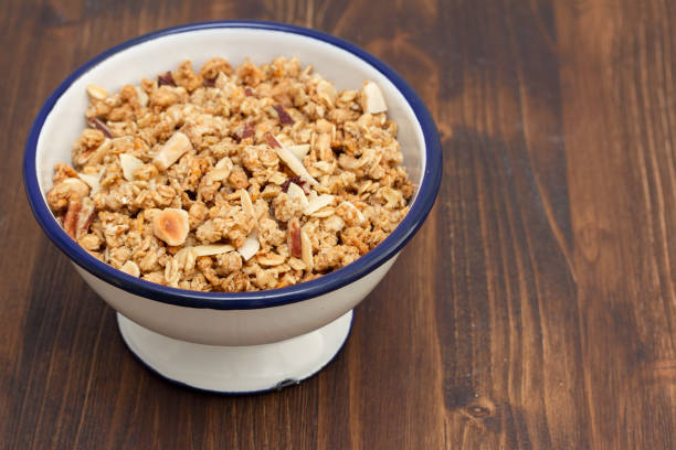 istock granola with nuts in the bowl on wooden background 942177638