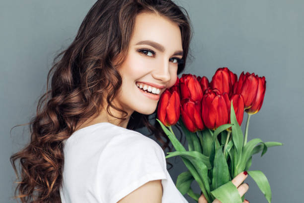 istock Beautiful woman with flowers 942178712