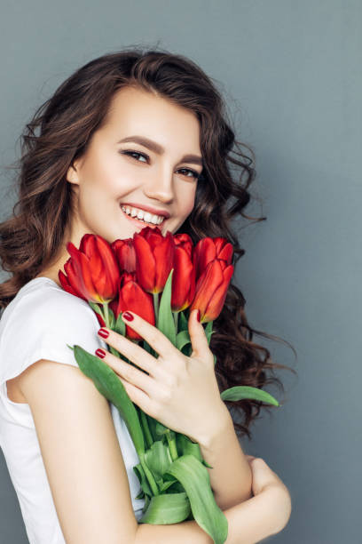 istock Beautiful woman with flowers 942178726