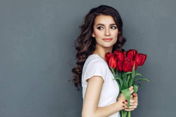 istock Beautiful woman with flowers 942178762