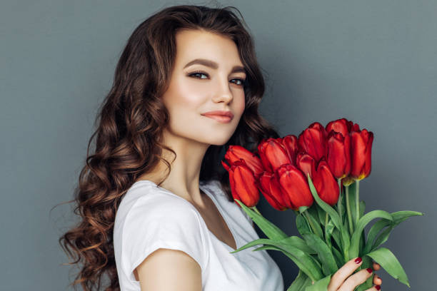 istock Beautiful woman with flowers 942178856