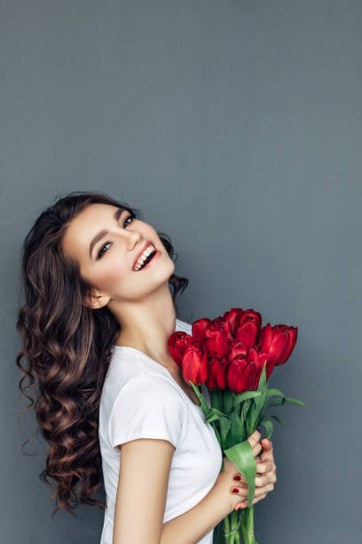 istock Beautiful woman with flowers 942178972