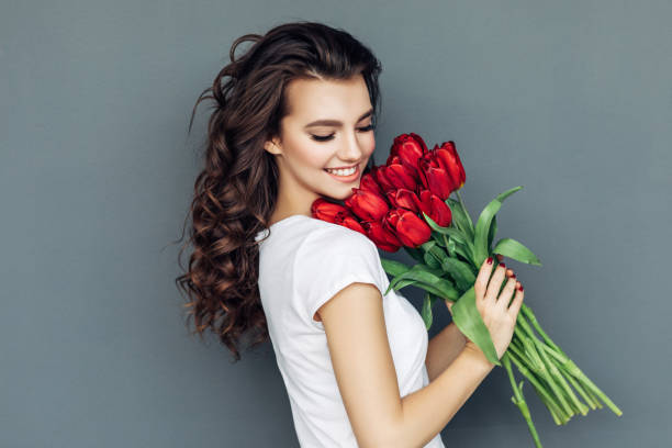 istock Beautiful woman with flowers 942178988