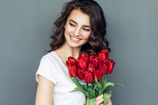 istock Beautiful woman with flowers 942179004