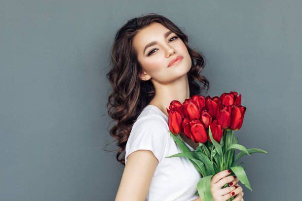 istock Beautiful woman with flowers 942179018