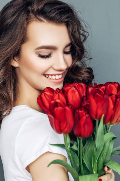 istock Beautiful woman with flowers 942179044