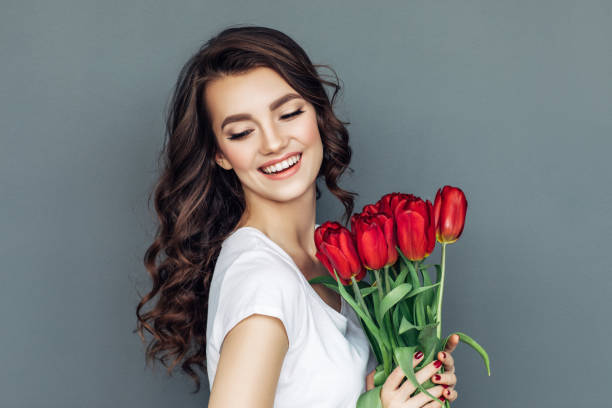istock Beautiful woman with flowers 942179070