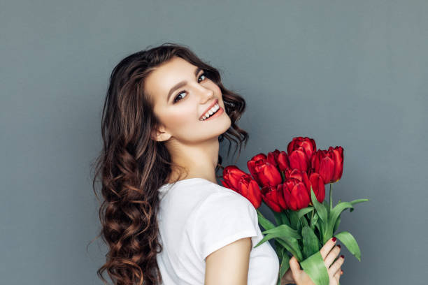 istock Beautiful woman with flowers 942179110