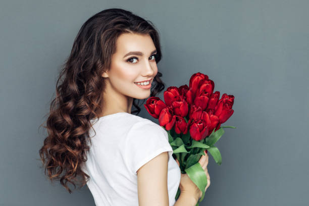 istock Beautiful woman with flowers 942179156